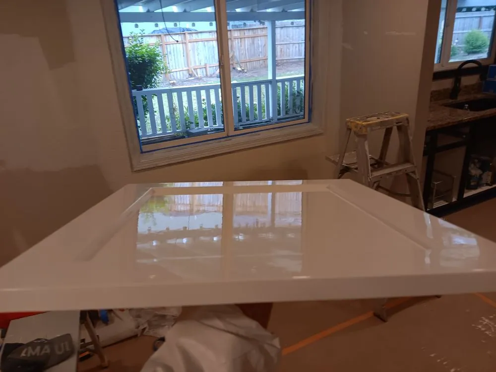 A cabinet door with a fresh gloss white finish
