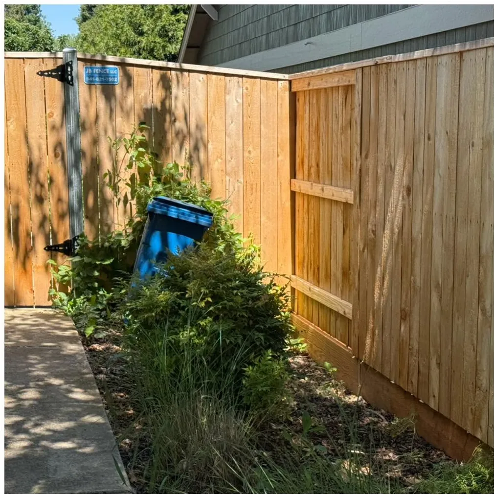 Before: a weathered wood fence and gate
